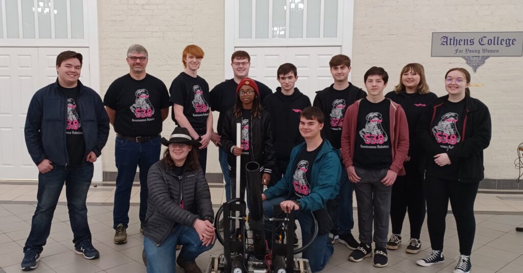 Our robotics team around our Hype Bot. The background is the main lobby of the Sandridge hall of Athens Community College. 